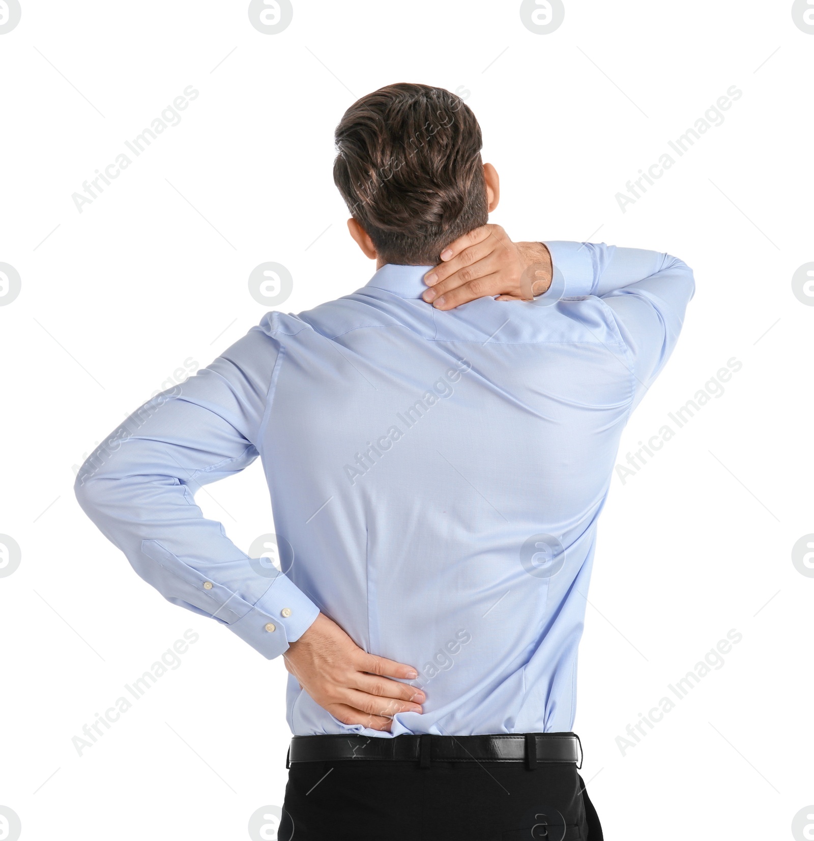 Young man suffering from back pain on white background Photo of Young man suffering from back pain on white background