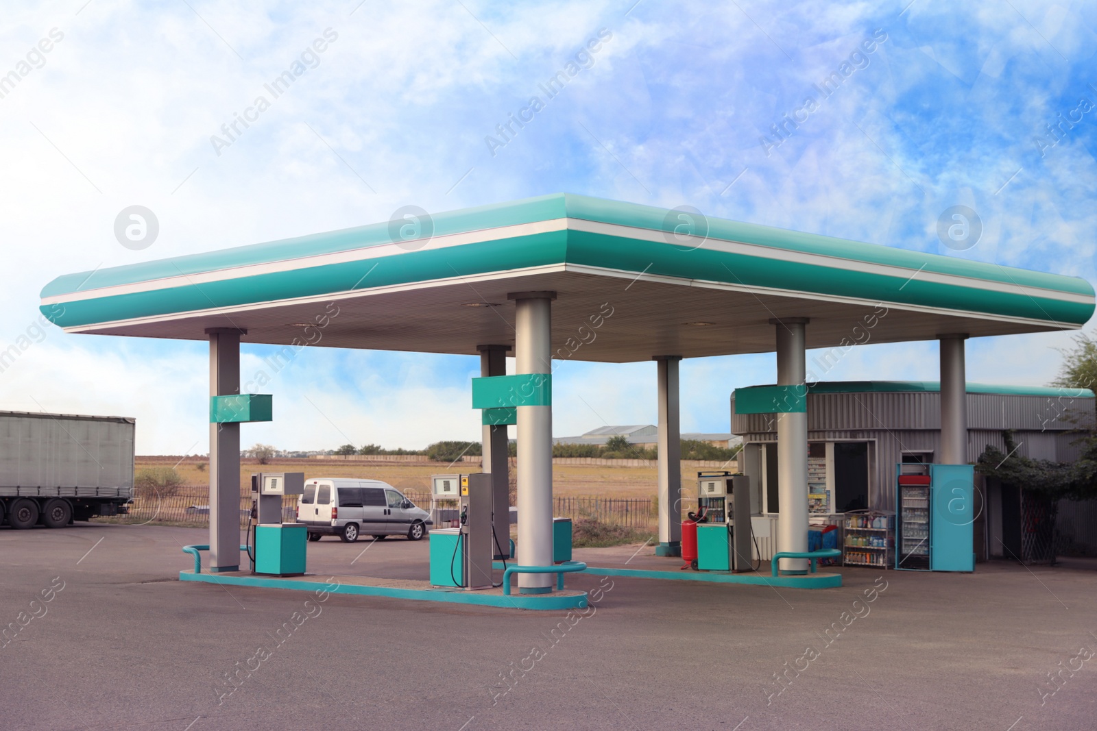 Modern gas station outdoors on sunny day Photo of Modern gas station outdoors on sunny day