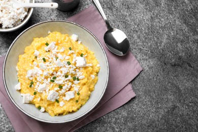 Traditional Ukrainian banosh served with brynza and cut green onions on grey table, flat lay. Space for text Photo of Traditional Ukrainian banosh served with brynza and cut green onions on grey table, flat lay. Space for text