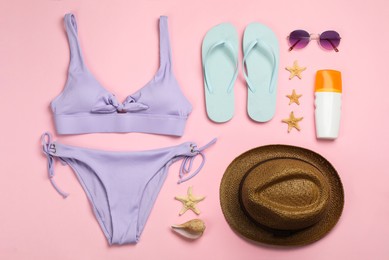 Flat lay composition with beach objects on pink background Photo of Flat lay composition with beach objects on pink background