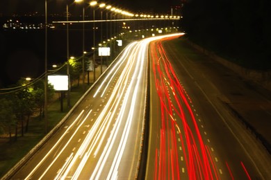 Road with light trails in city, motion blur effect. Night life Photo of Road with light trails in city, motion blur effect. Night life