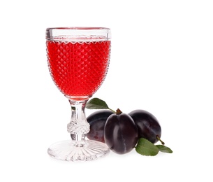 Delicious plum liquor and ripe fruits on white background. Homemade strong alcoholic beverage Photo of Delicious plum liquor and ripe fruits on white background. Homemade strong alcoholic beverage