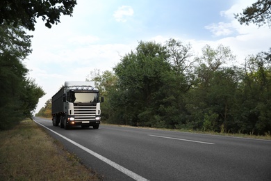 Beautiful view of asphalt highway with truck. Road trip Photo of Beautiful view of asphalt highway with truck. Road trip