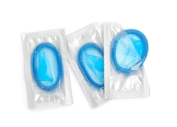 Condom packages on white background, top view. Safe sex Photo of Condom packages on white background, top view. Safe sex
