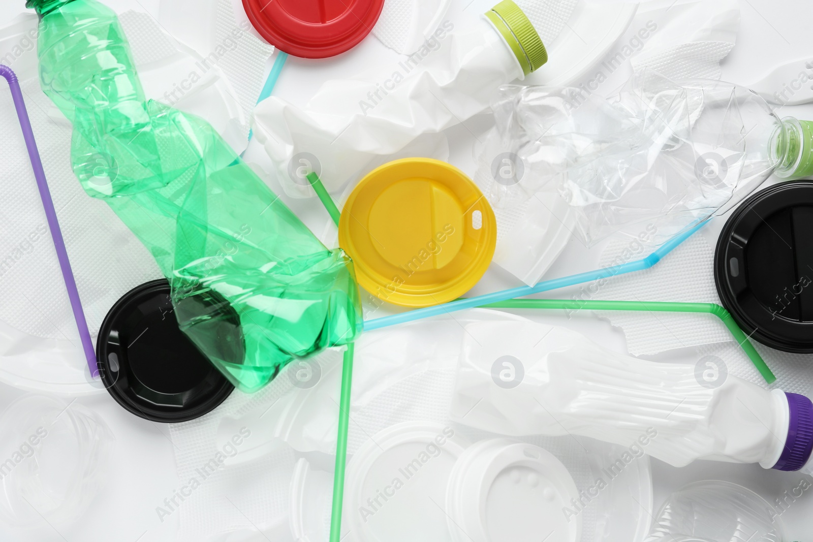 Pile of different plastic items as background, top view Photo of Pile of different plastic items as background, top view