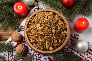 Traditional Christmas slavic dish kutia served on wooden table, flat lay Photo of Traditional Christmas slavic dish kutia served on wooden table, flat lay