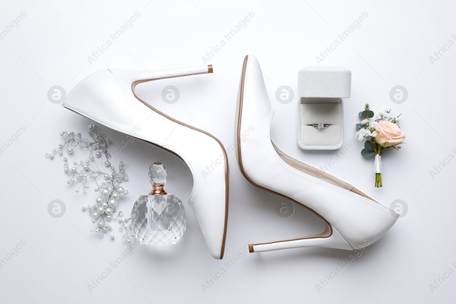 Composition with wedding high heel shoes on white background, top view Photo of Composition with wedding high heel shoes on white background, top view