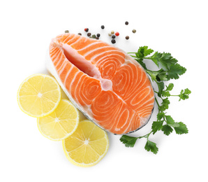 Fresh raw salmon with pepper, lemon and parsley on white background, top view. Fish delicacy Photo of Fresh raw salmon with pepper, lemon and parsley on white background, top view. Fish delicacy