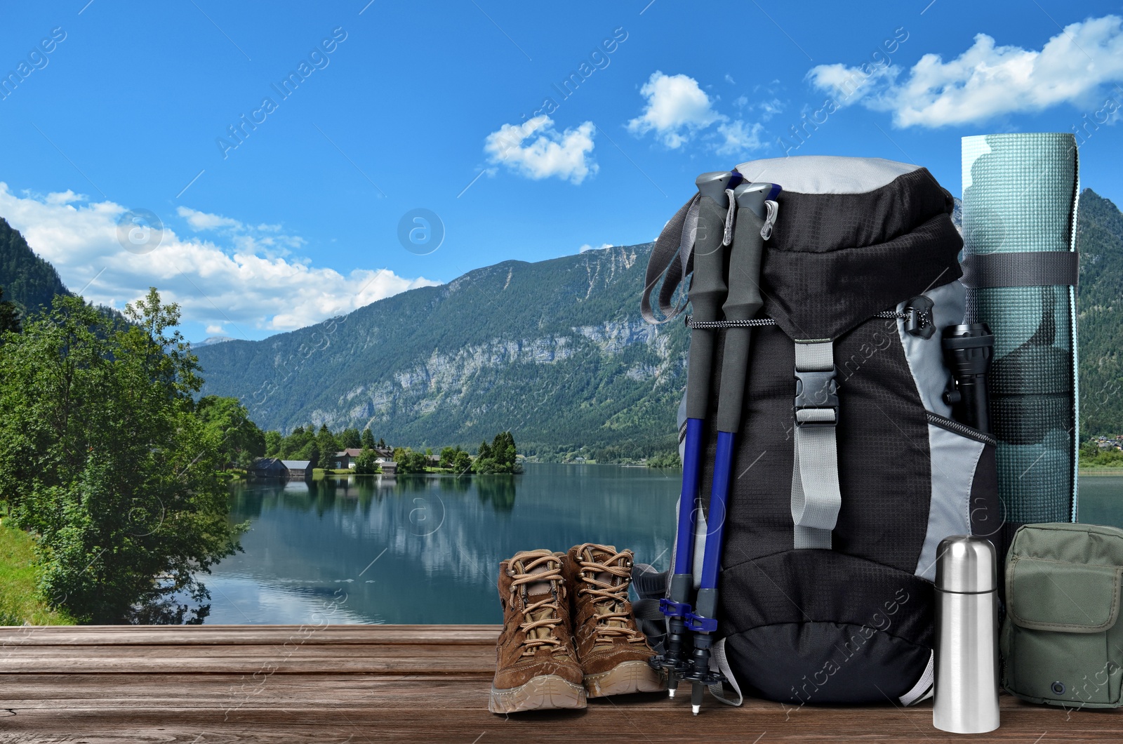 Camping equipment for tourist on wooden surface and beautiful view of mountain landscape Image of Camping equipment for tourist on wooden surface and beautiful view of mountain landscape