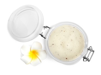 Jar of exfoliating salt scrub and plumeria flower on white background, top view Photo of Jar of exfoliating salt scrub and plumeria flower on white background, top view