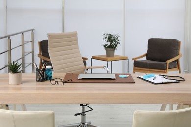 Photo of Modern doctor's workplace in office. Interior design