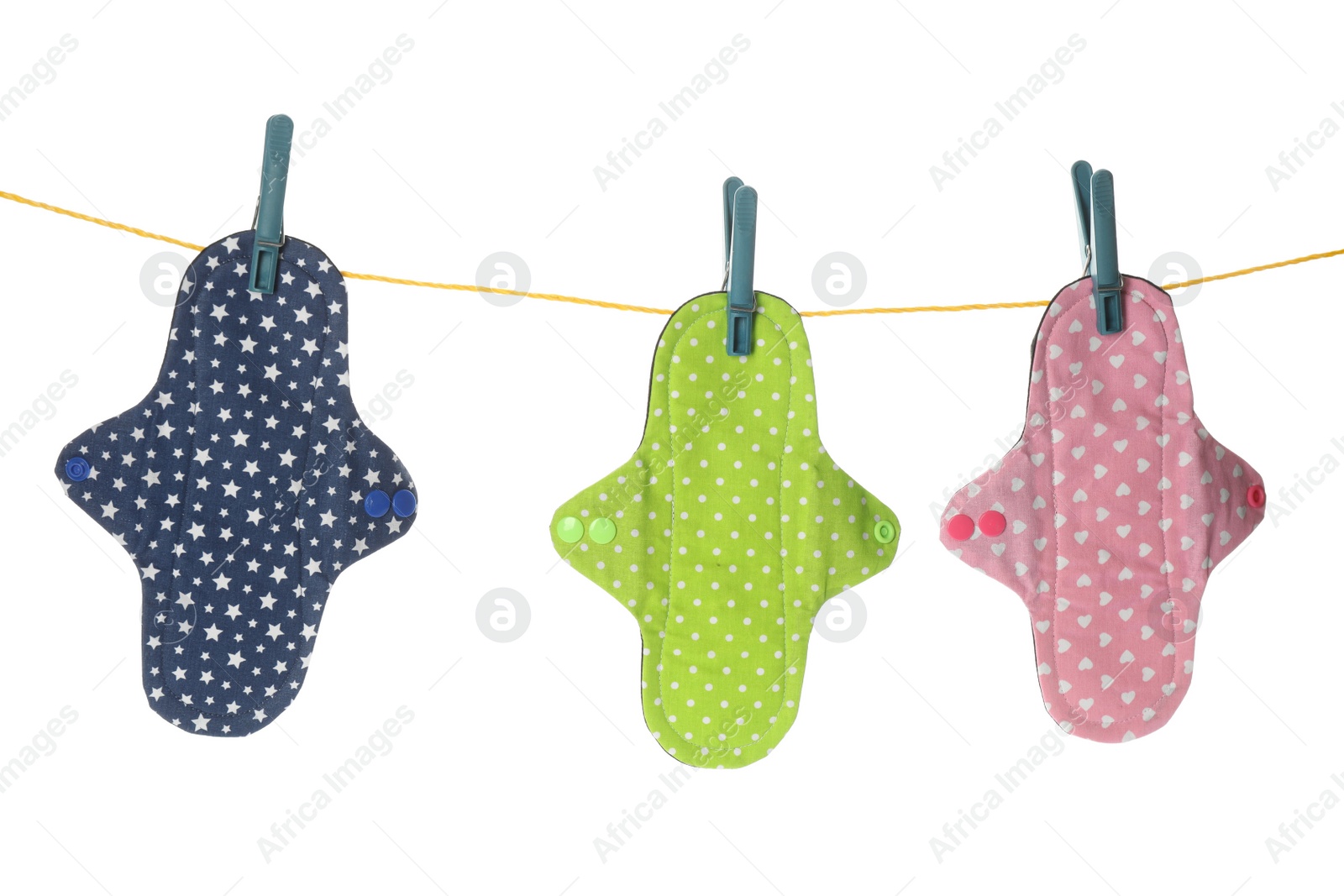 Many different cloth menstrual pads hanging isolated on white Photo of Many different cloth menstrual pads hanging isolated on white