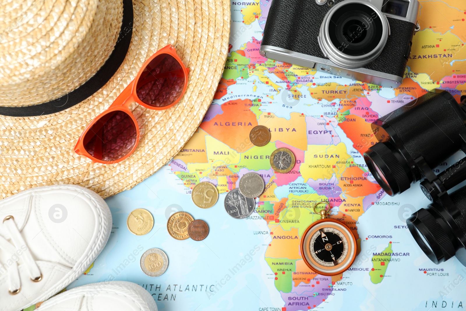 Flat lay composition with different travel accessories on world map. Planning summer vacation trip Photo of Flat lay composition with different travel accessories on world map. Planning summer vacation trip