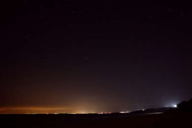 Picturesque view of starry sky at night on seaside Photo of Picturesque view of starry sky at night on seaside