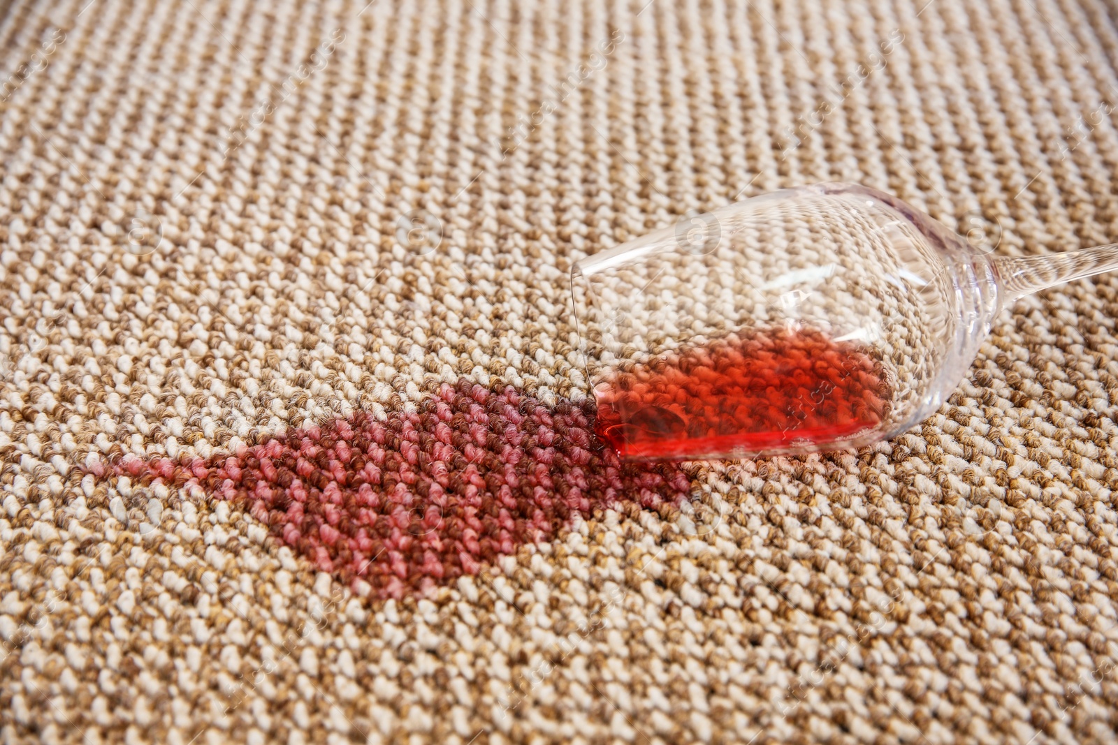 Spilled red wine on carpet Photo of Spilled red wine on carpet