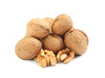 Pile of ripe walnuts on white background Photo of Pile of ripe walnuts on white background