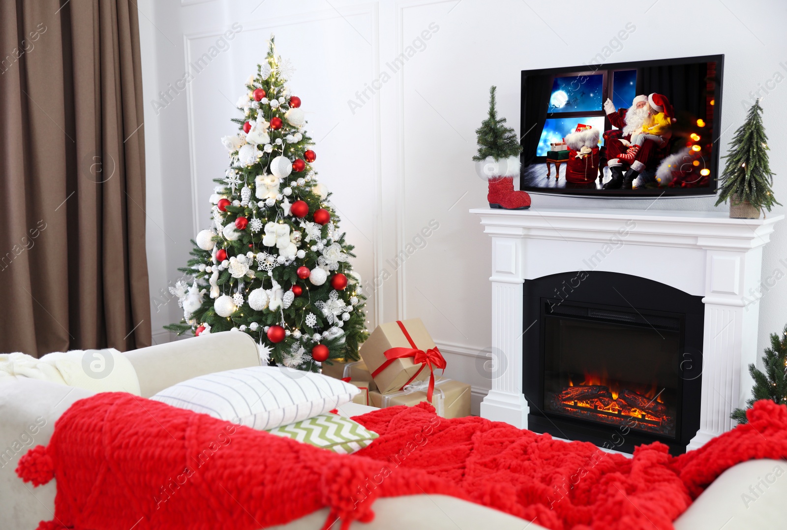 Stylish living room interior with TV set, Christmas tree and fireplace Image of Stylish living room interior with TV set, Christmas tree and fireplace