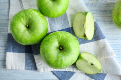 Fresh green apples on wooden table Photo of Fresh green apples on wooden table