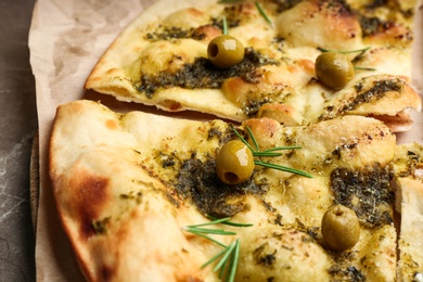 Delicious focaccia bread with green olives, closeup Photo of Delicious focaccia bread with green olives, closeup