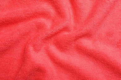 Crumpled red microfiber cloth as background, closeup Photo of Crumpled red microfiber cloth as background, closeup