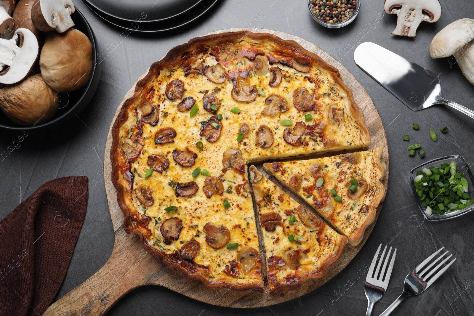 Delicious pie with mushrooms and cheese served on dark table, flat lay Photo of Delicious pie with mushrooms and cheese served on dark table, flat lay