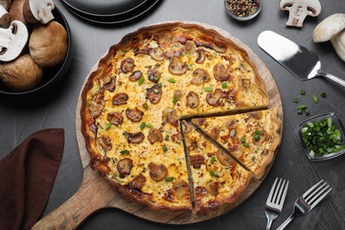 Delicious pie with mushrooms and cheese served on dark table, flat lay Photo of Delicious pie with mushrooms and cheese served on dark table, flat lay