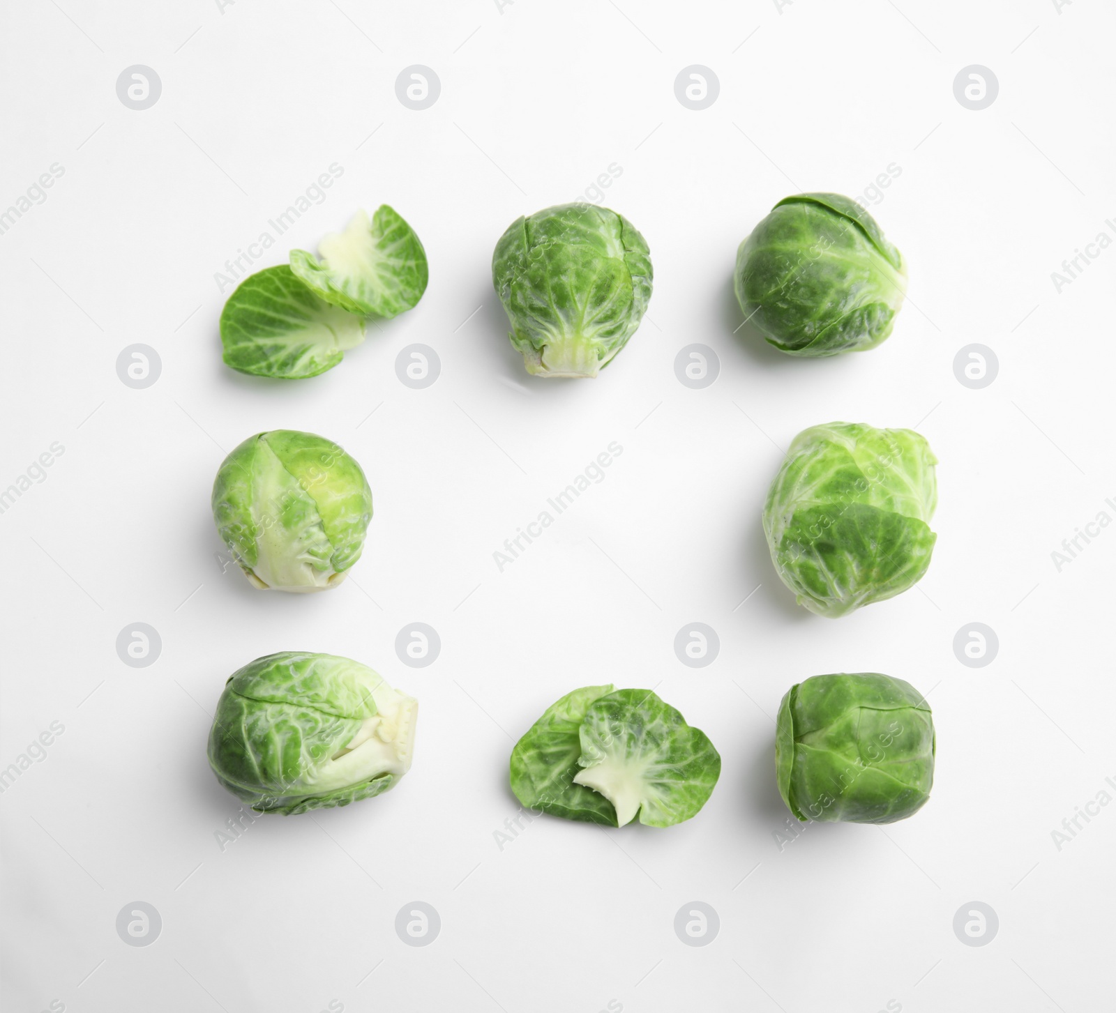 Fresh Brussels sprouts on white background, top view. Space for text Photo of Fresh Brussels sprouts on white background, top view. Space for text