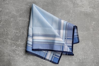 Stylish handkerchief on light grey table, top view Photo of Stylish handkerchief on light grey table, top view