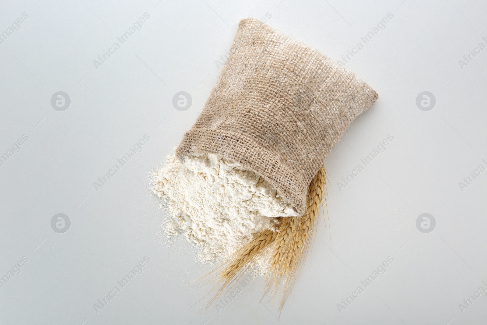 Sack with flour on white background Photo of Sack with flour on white background