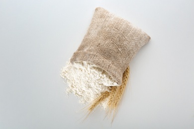 Sack with flour on white background Photo of Sack with flour on white background