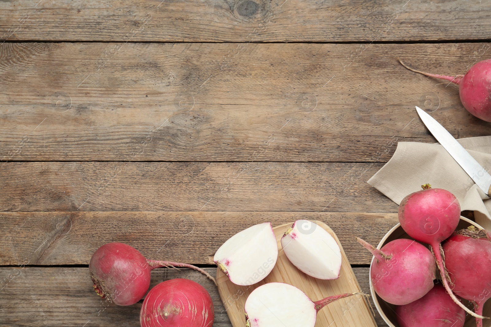 Raw red turnips on wooden table, flat lay. Space for text Photo of Raw red turnips on wooden table, flat lay. Space for text