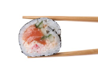 Chopsticks with tasty sushi roll on white background, closeup Photo of Chopsticks with tasty sushi roll on white background, closeup