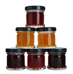 Jars with different jams on white background Photo of Jars with different jams on white background