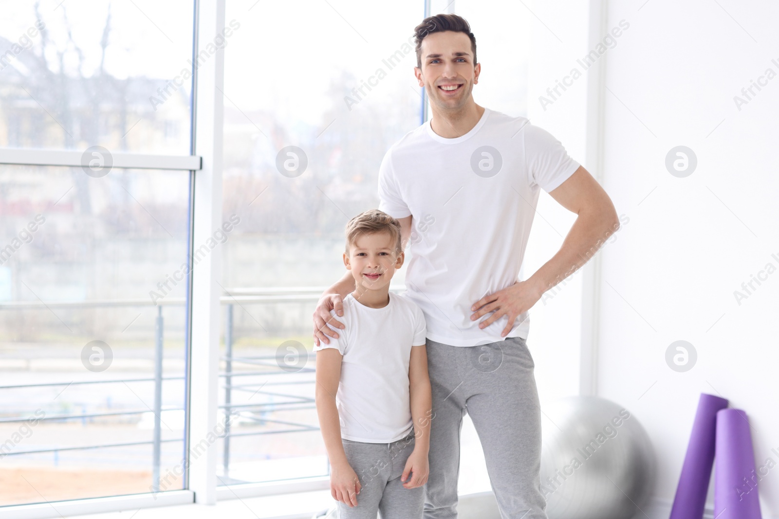 Dad and his son in gym Photo of Dad and his son in gym