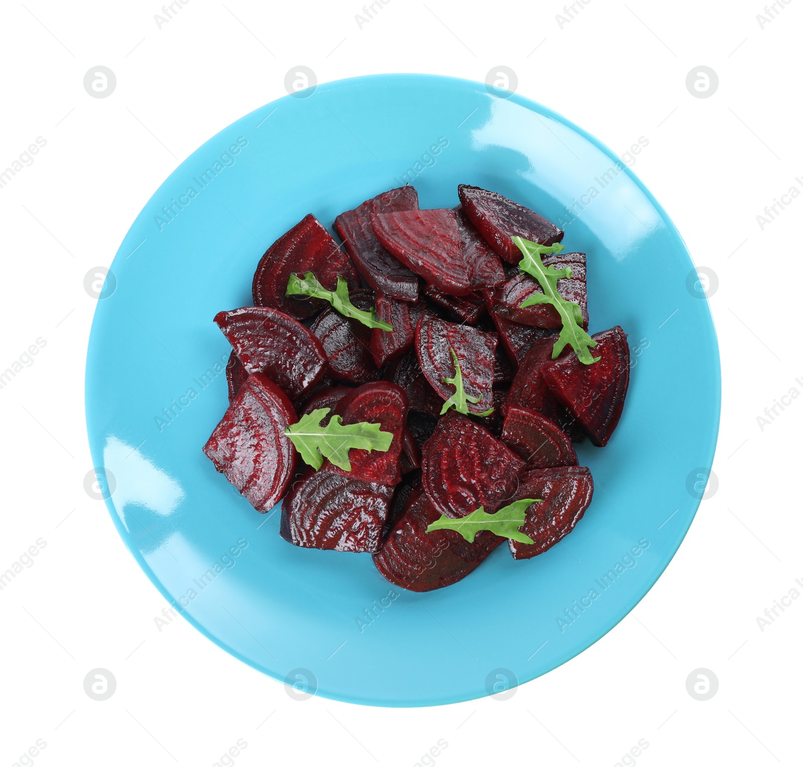 Plate with roasted beetroot slices and arugula isolated on white, top view Photo of Plate with roasted beetroot slices and arugula isolated on white, top view