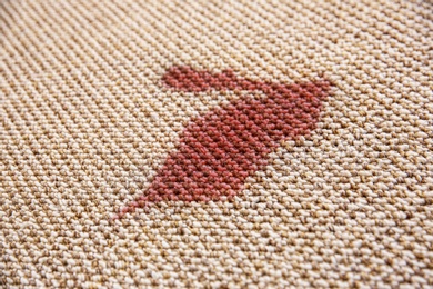 Spilled red wine on carpet Photo of Spilled red wine on carpet