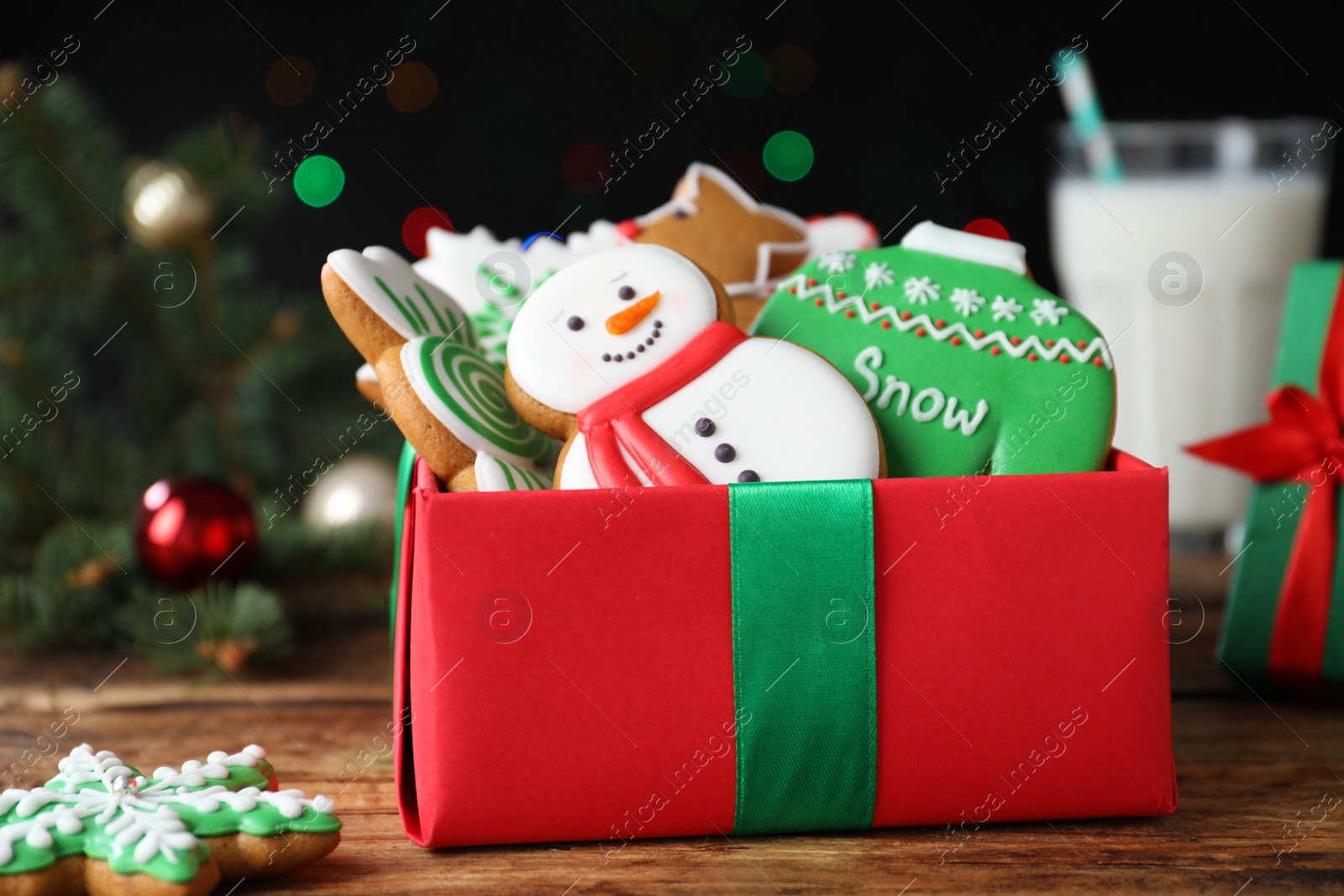 Tasty Christmas cookies in gift box on wooden table, closeup Photo of Tasty Christmas cookies in gift box on wooden table, closeup