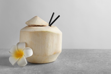 Fresh coconut drink in nut on table Photo of Fresh coconut drink in nut on table