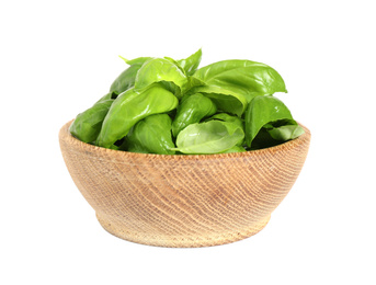 Photo of Fresh green basil leaves in wooden bowl isolated on white
