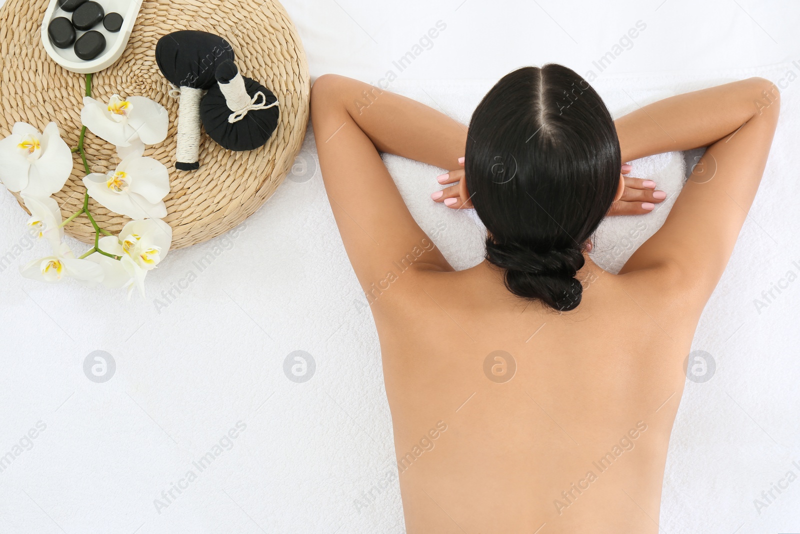 Young woman relaxing in spa salon, top view Photo of Young woman relaxing in spa salon, top view