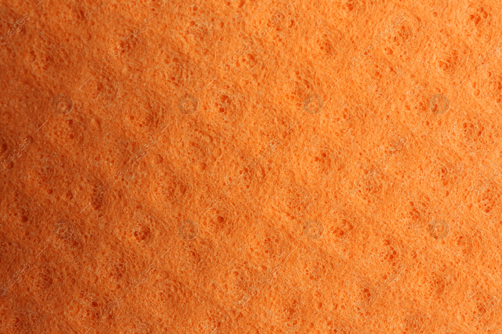 Orange foam rubber as background, top view Photo of Orange foam rubber as background, top view