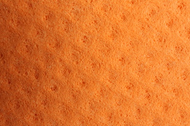Orange foam rubber as background, top view Photo of Orange foam rubber as background, top view