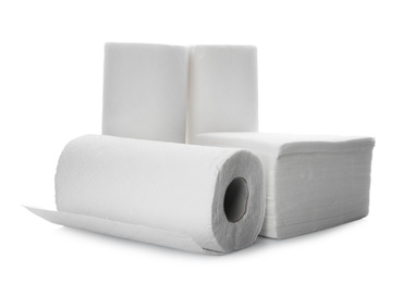 Rolls and stack of clean paper tissues on white background Photo of Rolls and stack of clean paper tissues on white background