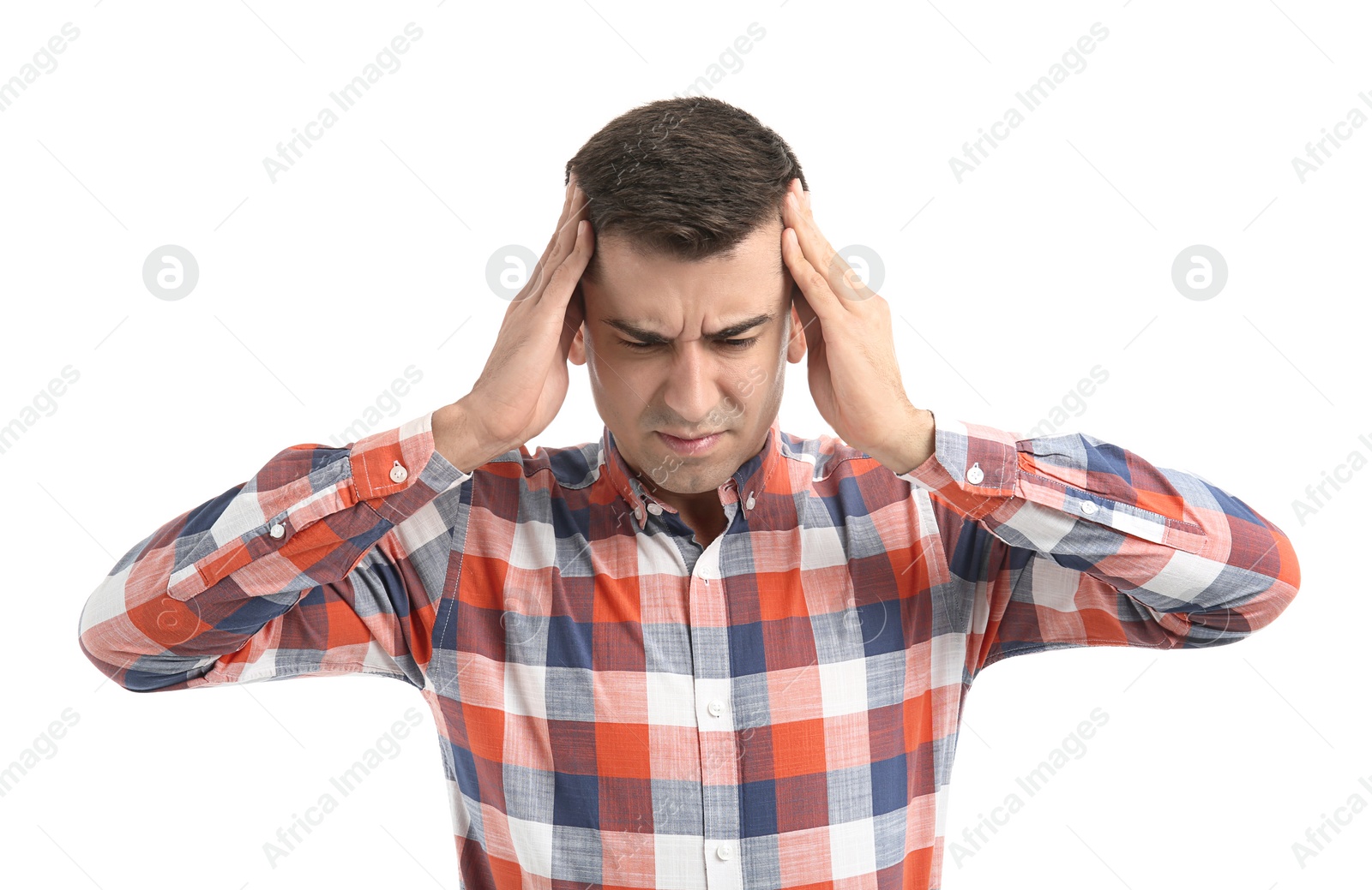 Young man suffering from headache on white background Photo of Young man suffering from headache on white background