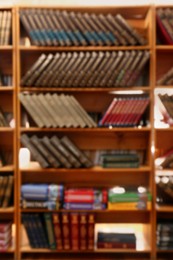 Blurred view of books on shelves in library Photo of Blurred view of books on shelves in library