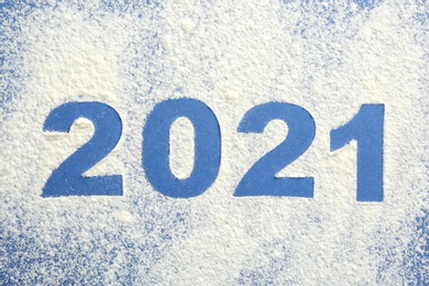 2012 made of flour on blue background, top view Photo of 2012 made of flour on blue background, top view