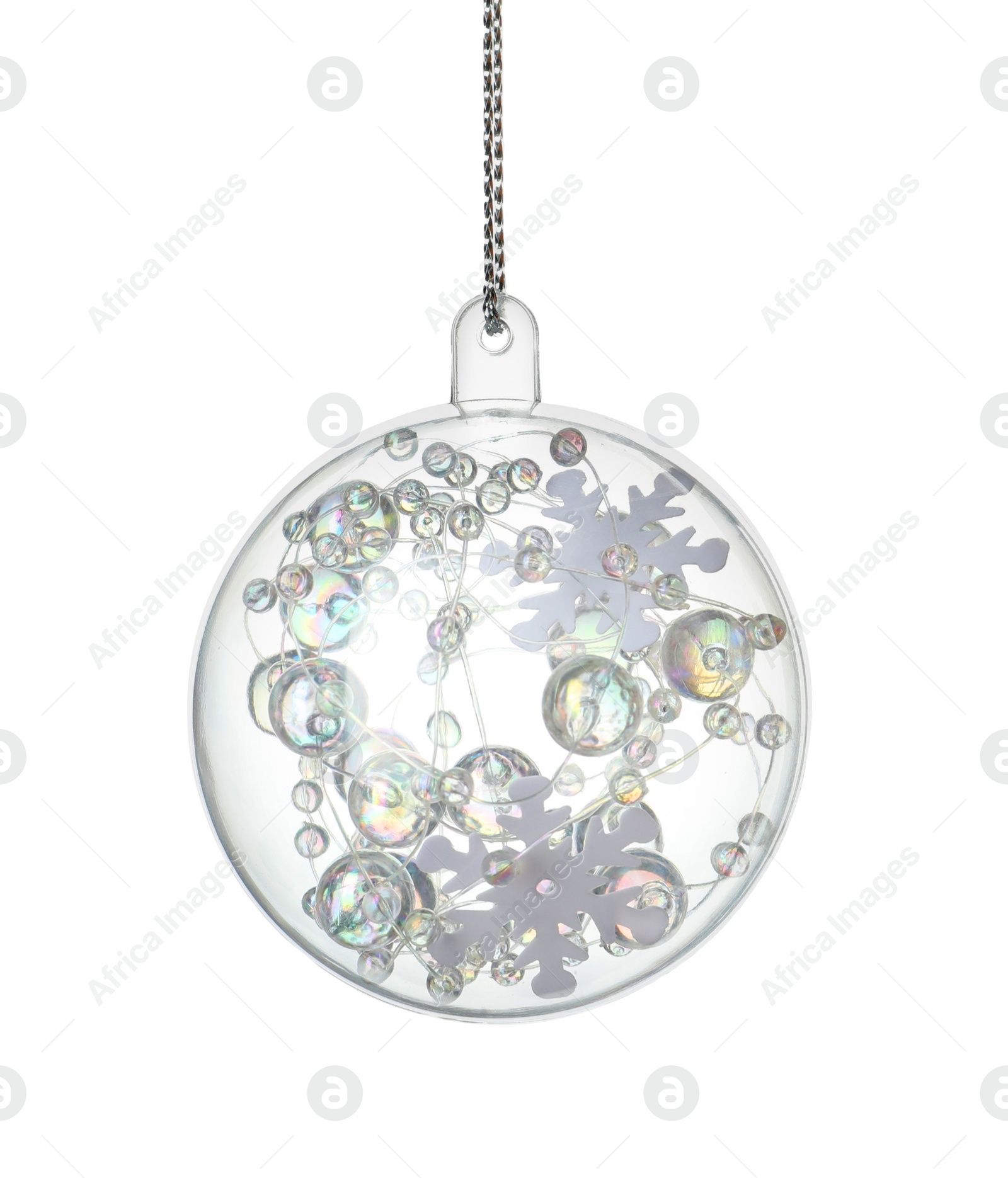 Decorative snow globe hanging on white background Photo of Decorative snow globe hanging on white background