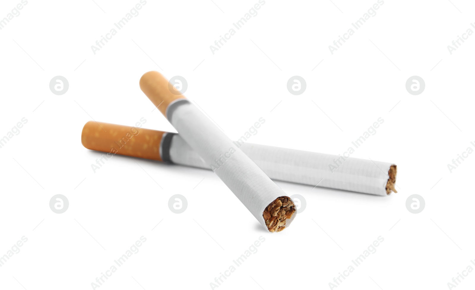 Cigarettes with orange filters isolated on white Photo of Cigarettes with orange filters isolated on white