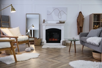 Beautiful living room interior with fireplace and armchairs Photo of Beautiful living room interior with fireplace and armchairs