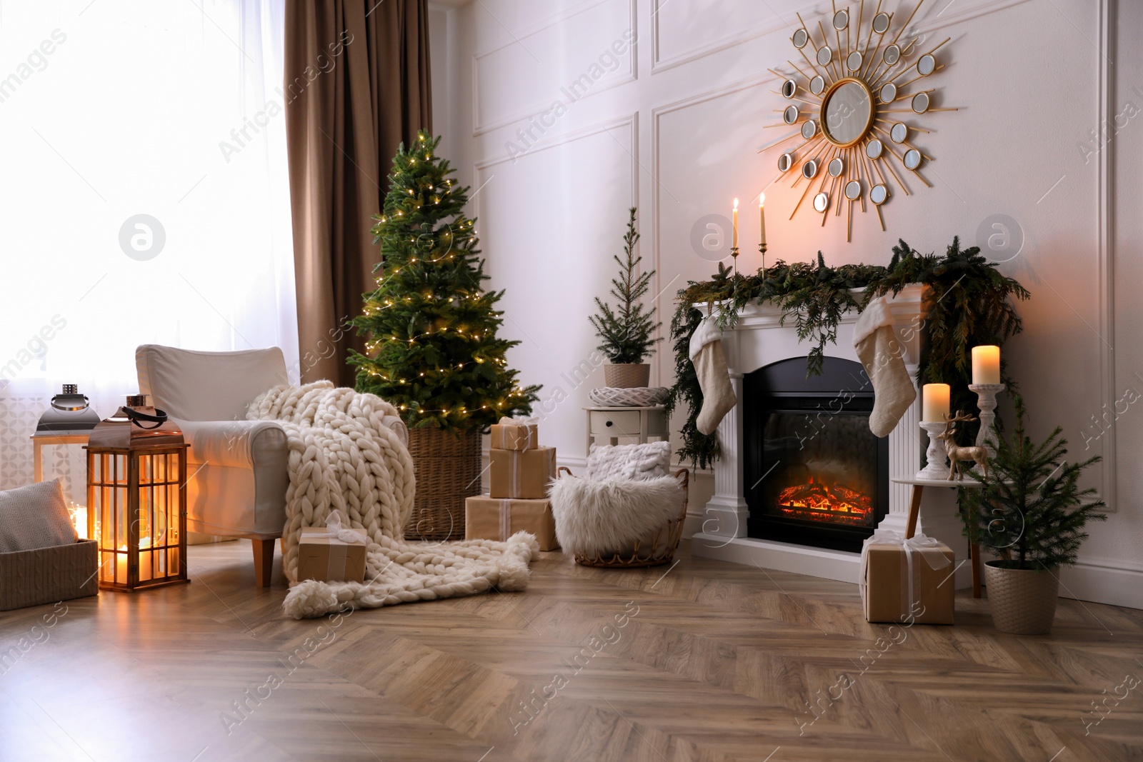 Stylish room interior with fireplace and beautiful Christmas tree Photo of Stylish room interior with fireplace and beautiful Christmas tree